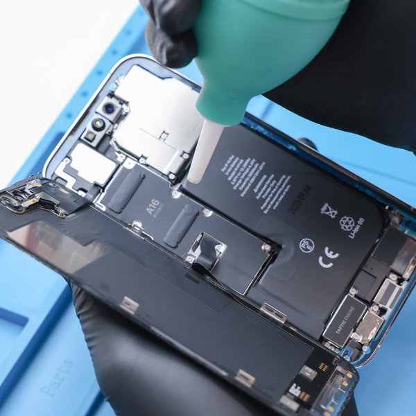 Prepping the surface of the iPhone for the new adhesive