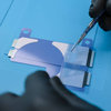 Applying the adhesive strips on new battery #2