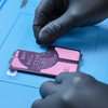 Applying the adhesive strips on new battery #4