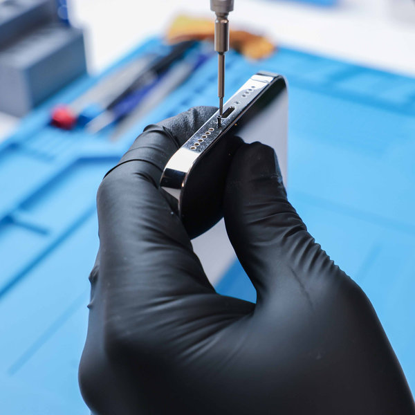 Unscrewing the bottom pentalobe screws