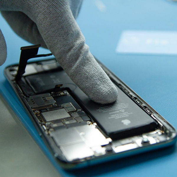Insert a new battery into iPhone