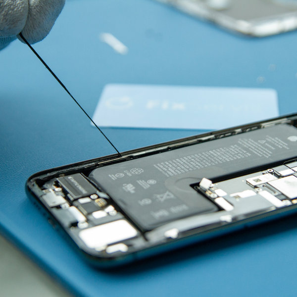 Peel off the old adhesive around the edges of the iPhone