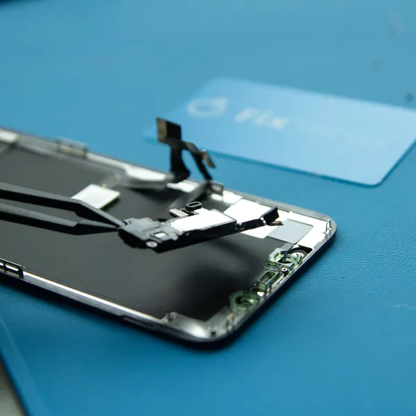 Remove the speaker + front sensor assembly