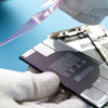 Apply new adhesive tape to the new battery #2