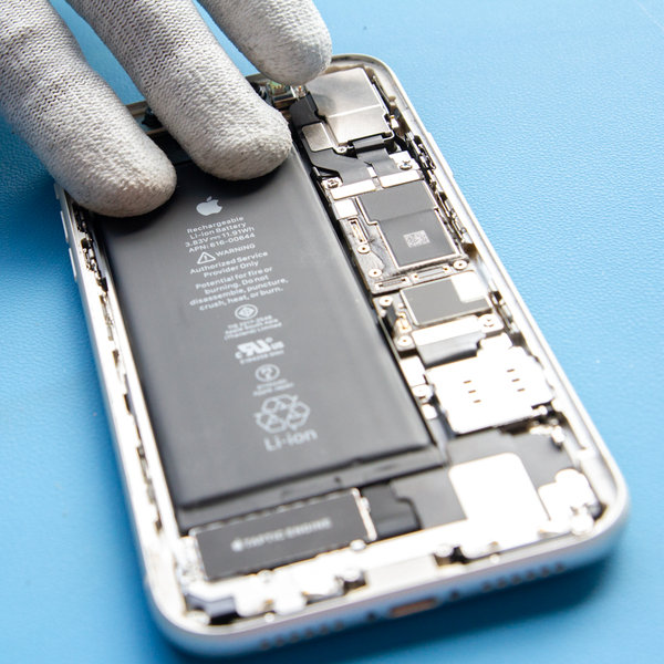 Insert a new battery into iPhone