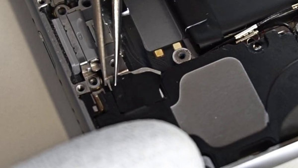 Removing the strips from the Wi-Fi antenna bracket